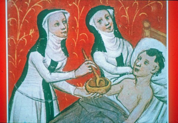 Depiction of nurses feeding a patient, Archives of the Hospital of Notre Dame, Tournai, foundation charter of 1238